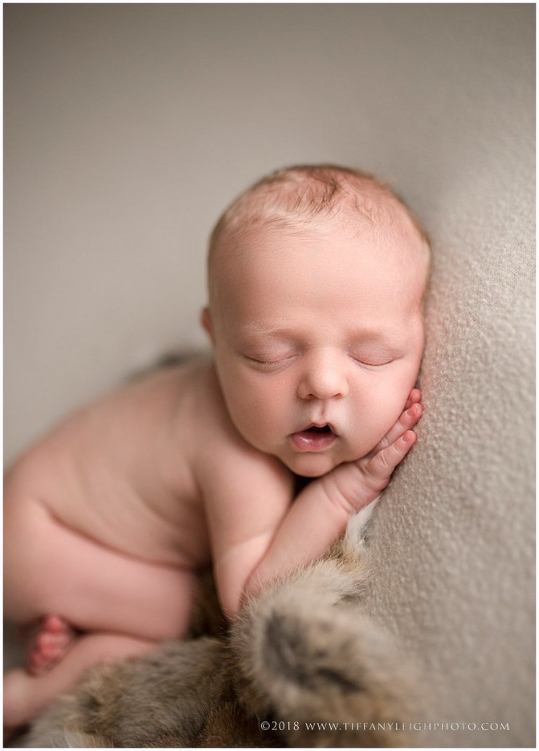 A baby is taking a nap. 