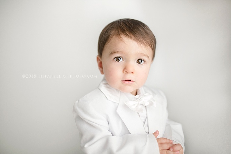 A baby wears a worried face. 