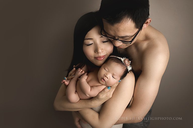 newborn parent posing