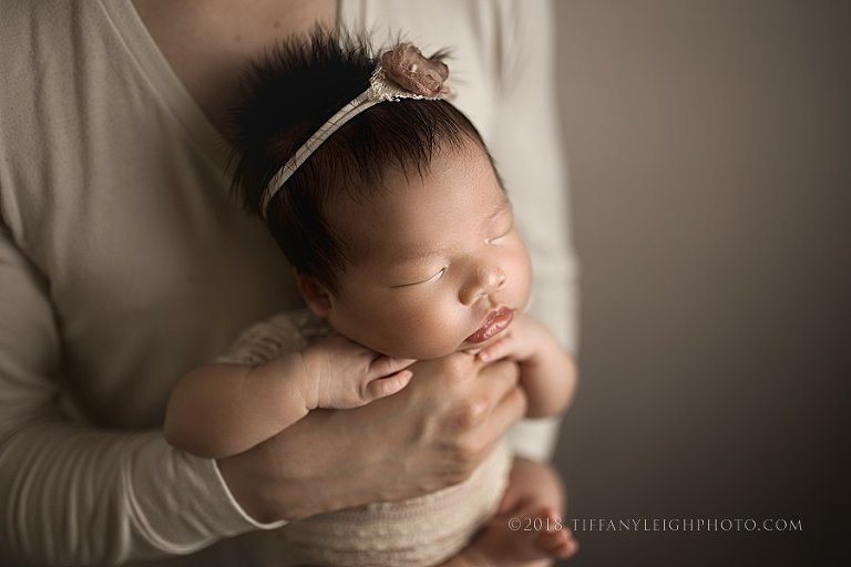 tiny baby in daddy's hands
