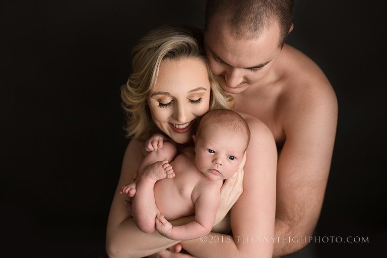 newborn parent posing