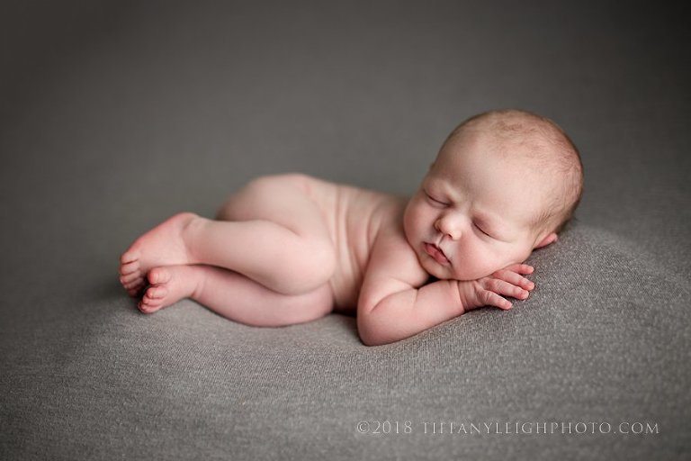 side laying on gray baby boy