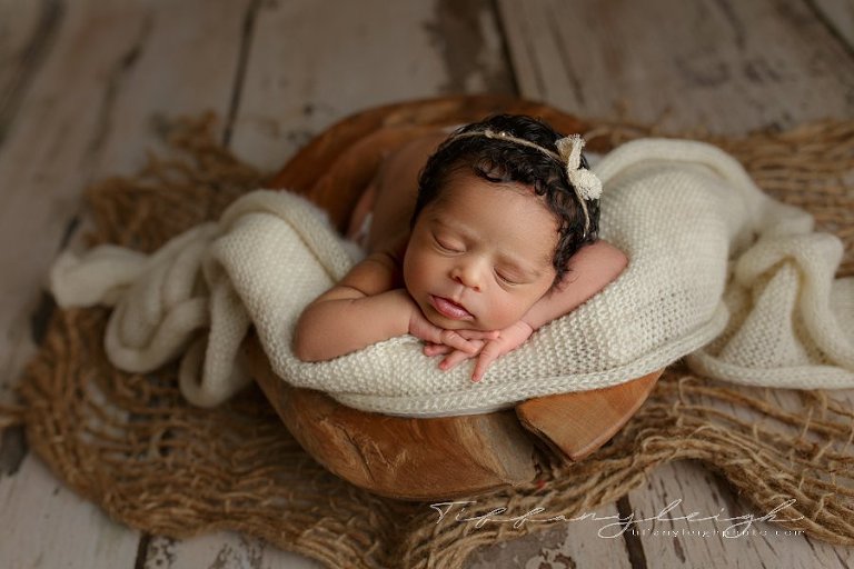 baby girl face forward in bowl