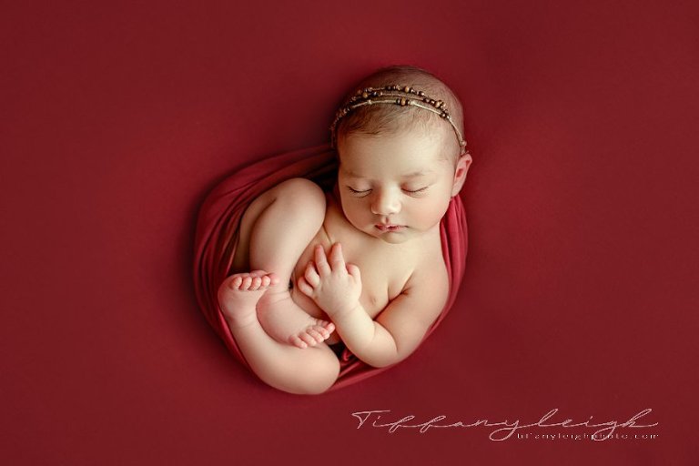 baby girl on red womb