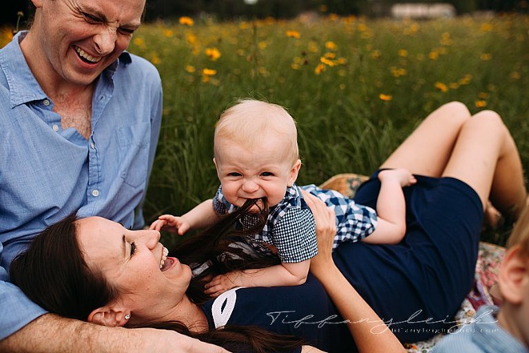 teething baby eating moms hair
