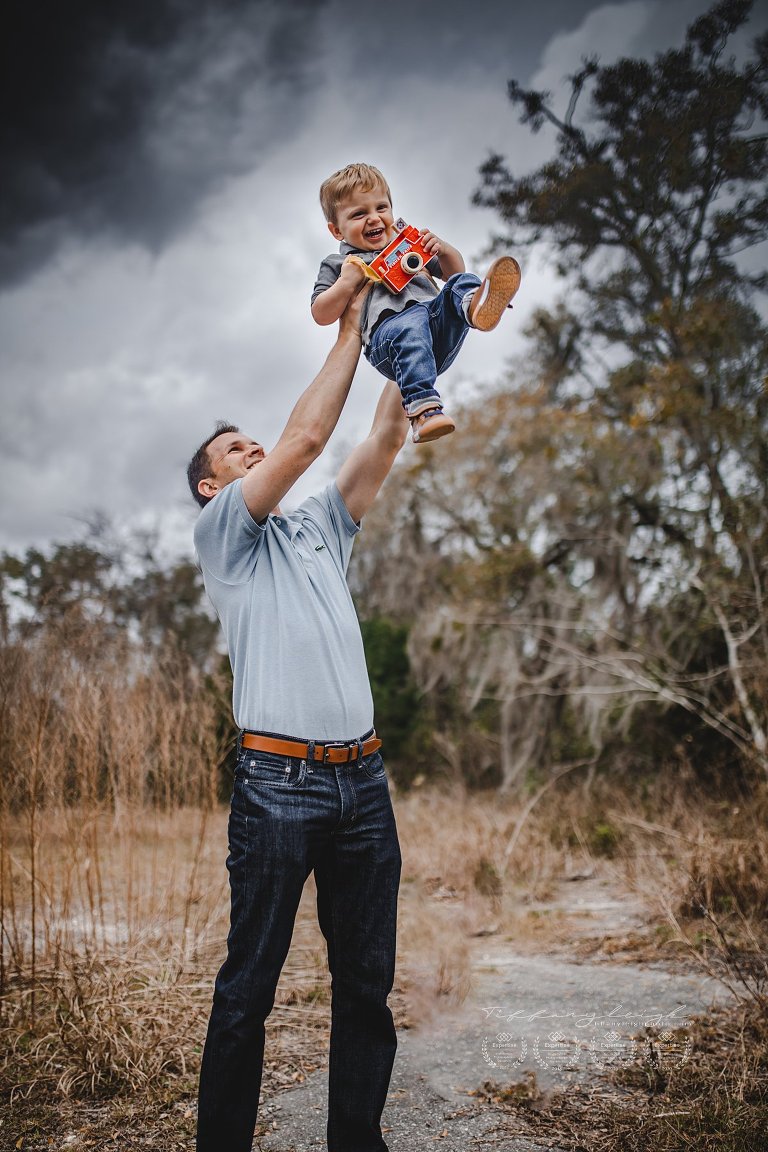 baby boy in air with daddy