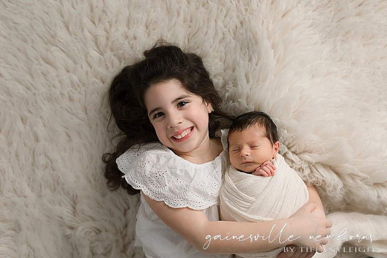 Newborn photos with big sister gainesville newborn photography
