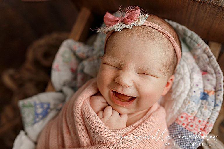 Baby smiling newborn photography