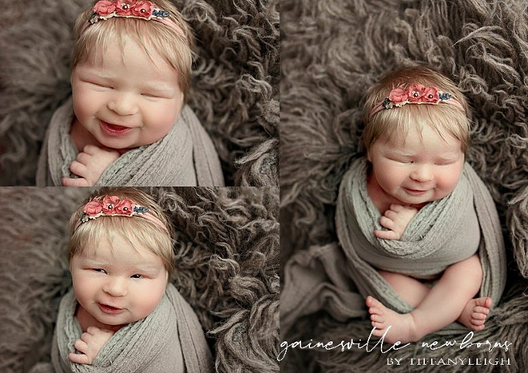 baby girl on grey rug 