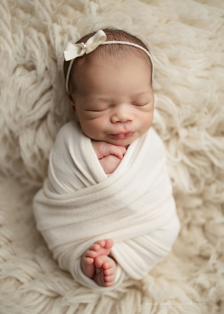 pretty baby swaddled toes out Florida photo studio