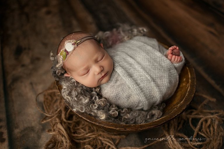 Baby posed in bowl newborn photography