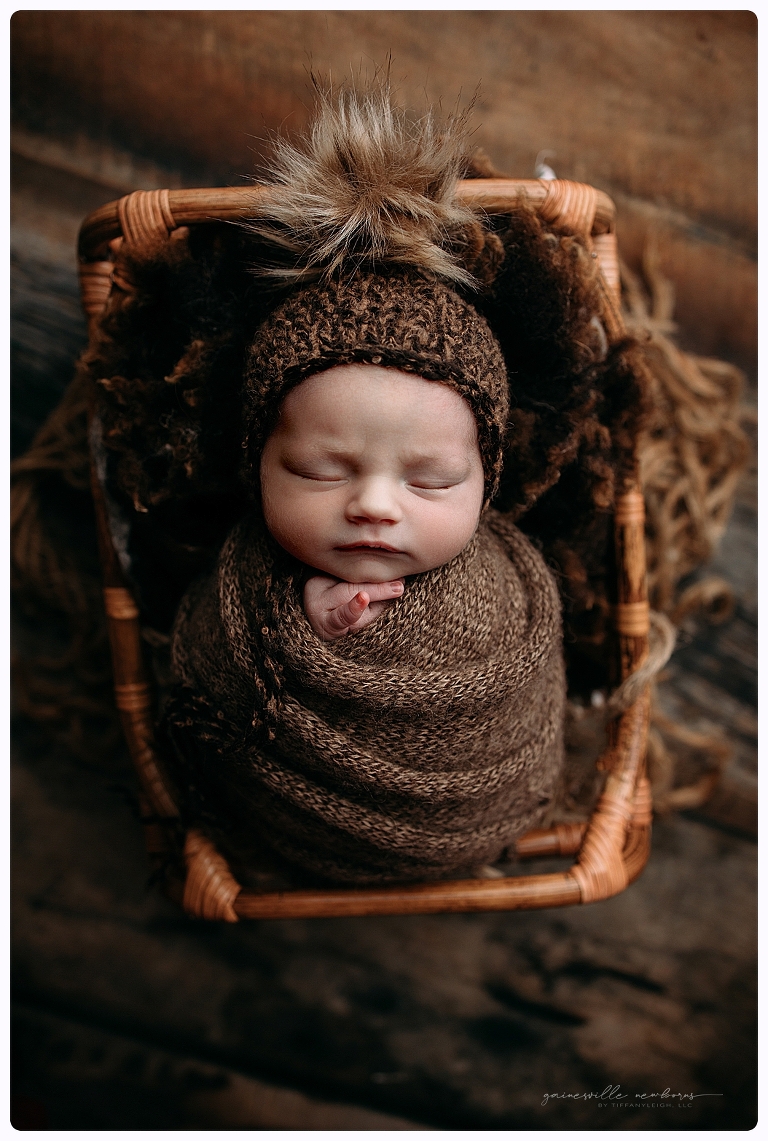 cute baby in bed prop newborn photo studio gainesville