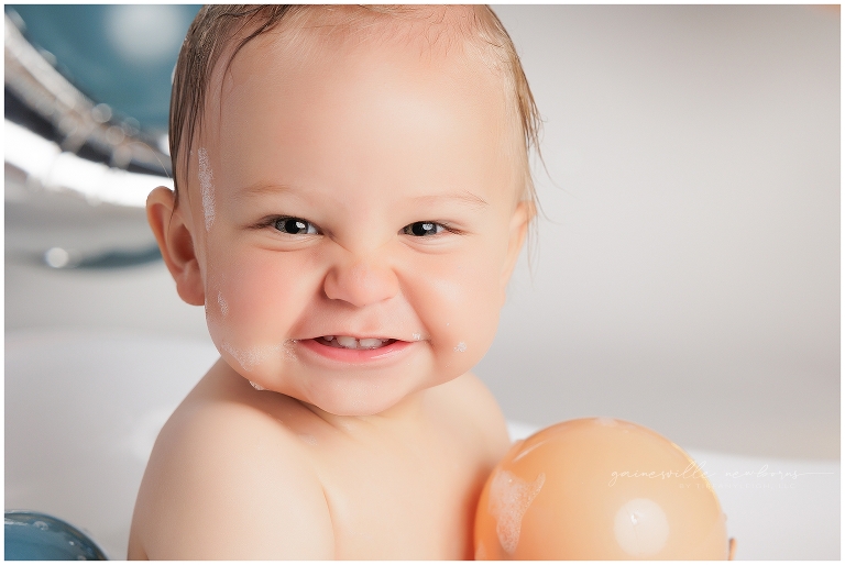 top gun,gainesville,florida,ocala,lake city,first birthday,one year old,cake smash,custom cake smash set,balloon garland,party,almost one,newborn to birthday,growing up,professional photography studio,premier cake smash photographer,celebrate,uf shands,hca north florida,first birthday cake,cake topper,theme,messy,icing,
