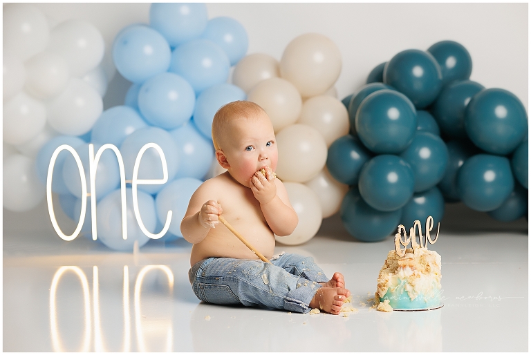 top gun,gainesville,florida,ocala,lake city,first birthday,one year old,cake smash,custom cake smash set,balloon garland,party,almost one,newborn to birthday,growing up,professional photography studio,premier cake smash photographer,celebrate,uf shands,hca north florida,first birthday cake,cake topper,theme,messy,icing,