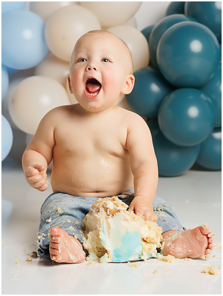 top gun,gainesville,florida,ocala,lake city,first birthday,one year old,cake smash,custom cake smash set,balloon garland,party,almost one,newborn to birthday,growing up,professional photography studio,premier cake smash photographer,celebrate,uf shands,hca north florida,first birthday cake,cake topper,theme,messy,icing,