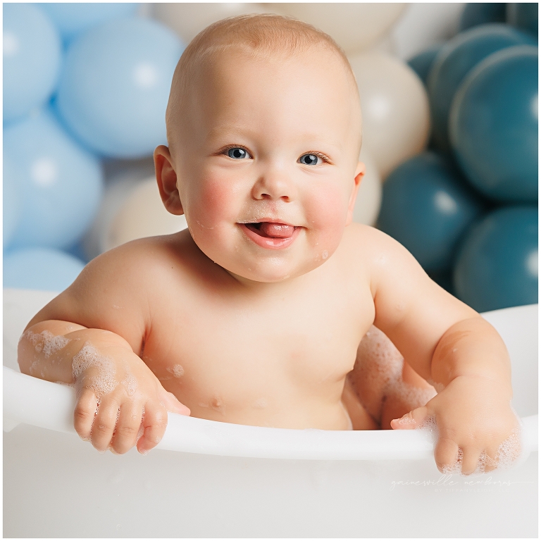 top gun,gainesville,florida,ocala,lake city,first birthday,one year old,cake smash,custom cake smash set,balloon garland,party,almost one,newborn to birthday,growing up,professional photography studio,premier cake smash photographer,celebrate,uf shands,hca north florida,first birthday cake,cake topper,theme,messy,icing,