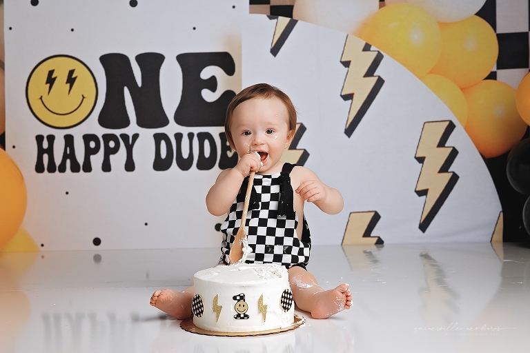 top gun,gainesville,florida,ocala,lake city,first birthday,one year old,cake smash,custom cake smash set,balloon garland,party,almost one,newborn to birthday,growing up,professional photography studio,premier cake smash photographer,celebrate,uf shands,hca north florida,first birthday cake,cake topper,theme,messy,icing,