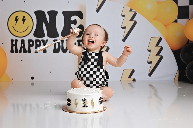 top gun,gainesville,florida,ocala,lake city,first birthday,one year old,cake smash,custom cake smash set,balloon garland,party,almost one,newborn to birthday,growing up,professional photography studio,premier cake smash photographer,celebrate,uf shands,hca north florida,first birthday cake,cake topper,theme,messy,icing,