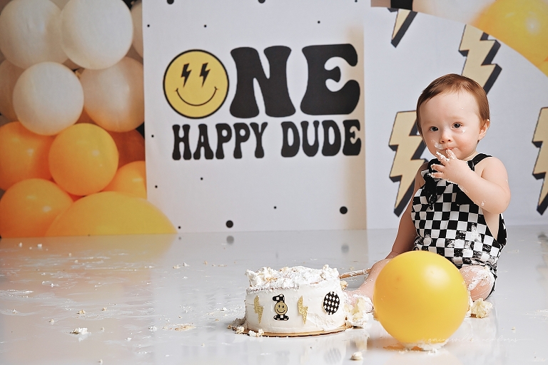 top gun,gainesville,florida,ocala,lake city,first birthday,one year old,cake smash,custom cake smash set,balloon garland,party,almost one,newborn to birthday,growing up,professional photography studio,premier cake smash photographer,celebrate,uf shands,hca north florida,first birthday cake,cake topper,theme,messy,icing,