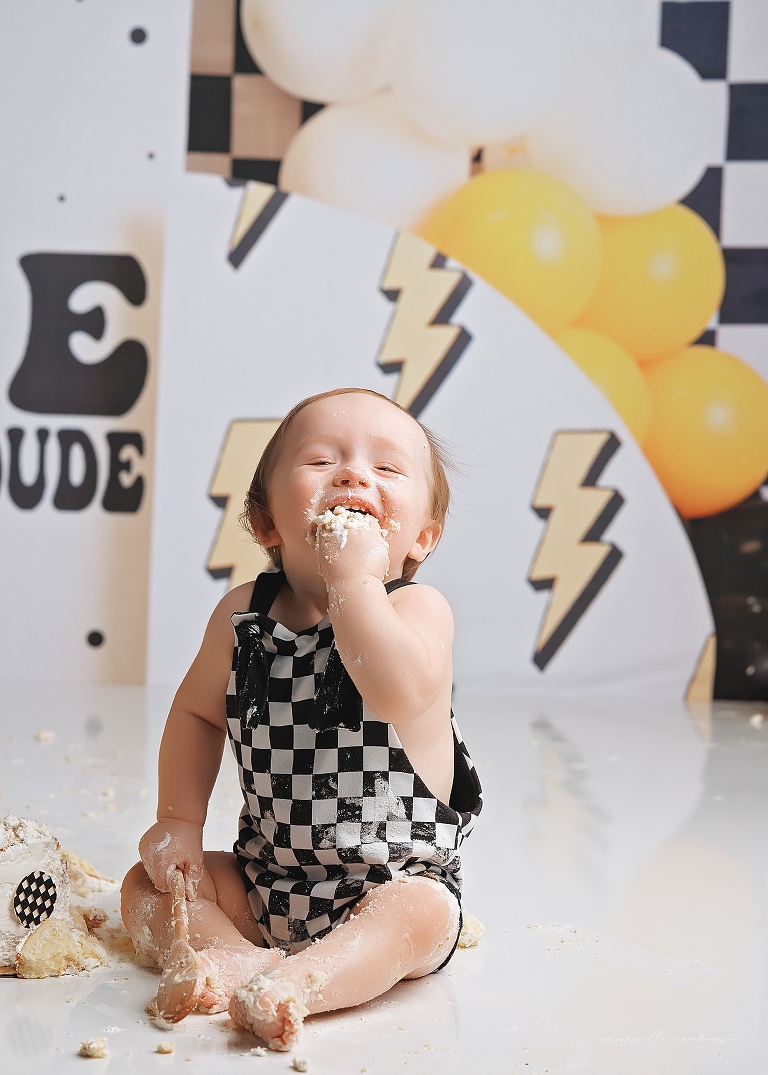 top gun,gainesville,florida,ocala,lake city,first birthday,one year old,cake smash,custom cake smash set,balloon garland,party,almost one,newborn to birthday,growing up,professional photography studio,premier cake smash photographer,celebrate,uf shands,hca north florida,first birthday cake,cake topper,theme,messy,icing,