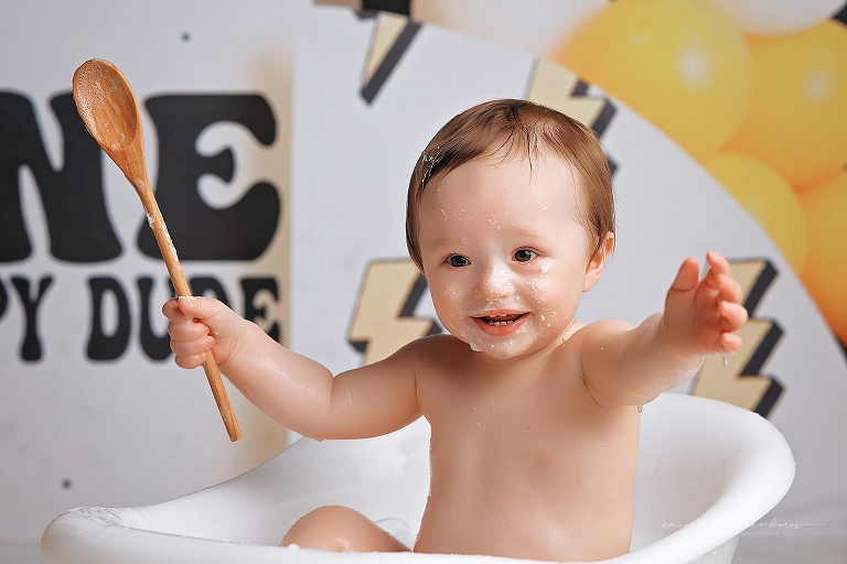 top gun,gainesville,florida,ocala,lake city,first birthday,one year old,cake smash,custom cake smash set,balloon garland,party,almost one,newborn to birthday,growing up,professional photography studio,premier cake smash photographer,celebrate,uf shands,hca north florida,first birthday cake,cake topper,theme,messy,icing,
