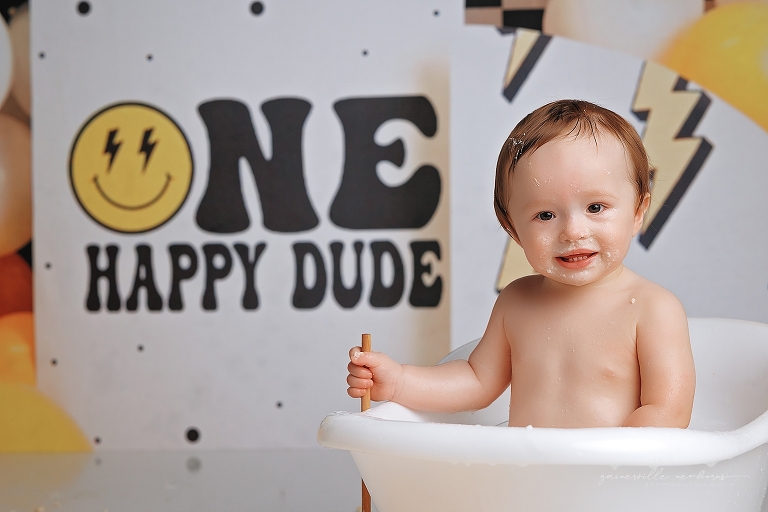 top gun,gainesville,florida,ocala,lake city,first birthday,one year old,cake smash,custom cake smash set,balloon garland,party,almost one,newborn to birthday,growing up,professional photography studio,premier cake smash photographer,celebrate,uf shands,hca north florida,first birthday cake,cake topper,theme,messy,icing,