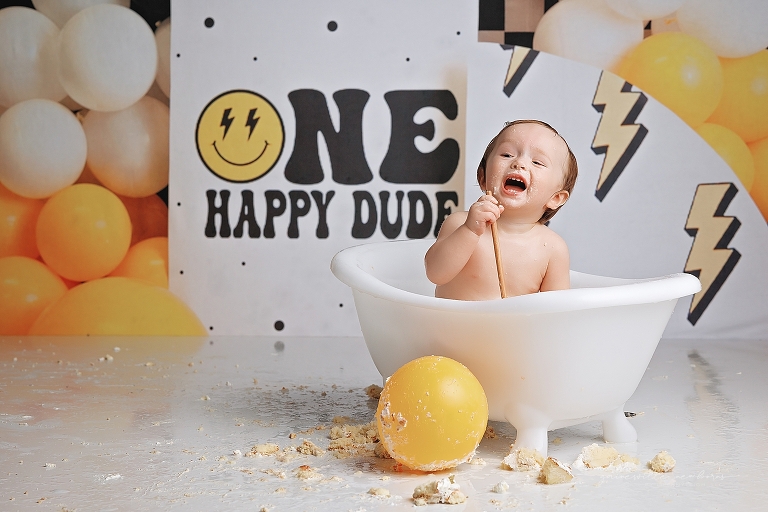 top gun,gainesville,florida,ocala,lake city,first birthday,one year old,cake smash,custom cake smash set,balloon garland,party,almost one,newborn to birthday,growing up,professional photography studio,premier cake smash photographer,celebrate,uf shands,hca north florida,first birthday cake,cake topper,theme,messy,icing,