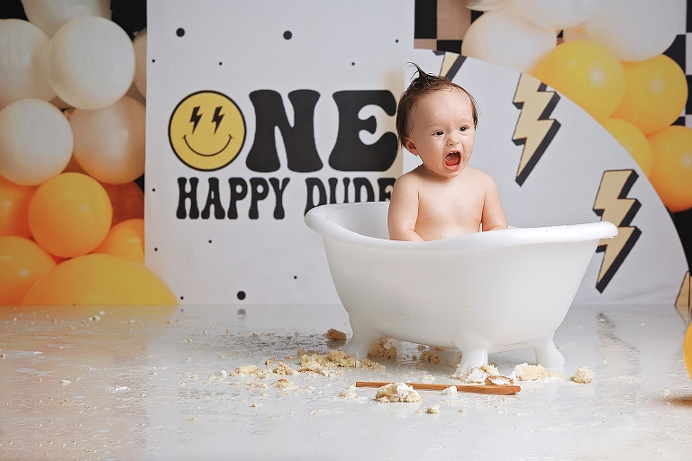 top gun,gainesville,florida,ocala,lake city,first birthday,one year old,cake smash,custom cake smash set,balloon garland,party,almost one,newborn to birthday,growing up,professional photography studio,premier cake smash photographer,celebrate,uf shands,hca north florida,first birthday cake,cake topper,theme,messy,icing,